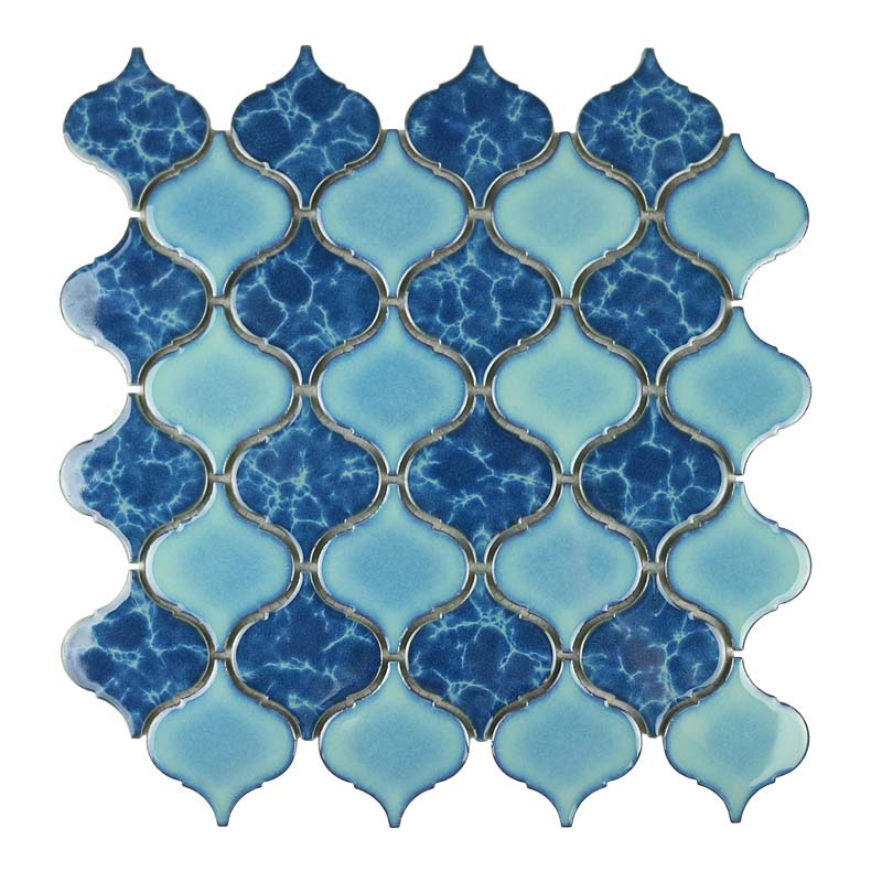 Light & dark blue porcelain tiles in arabesque pattern kitchen